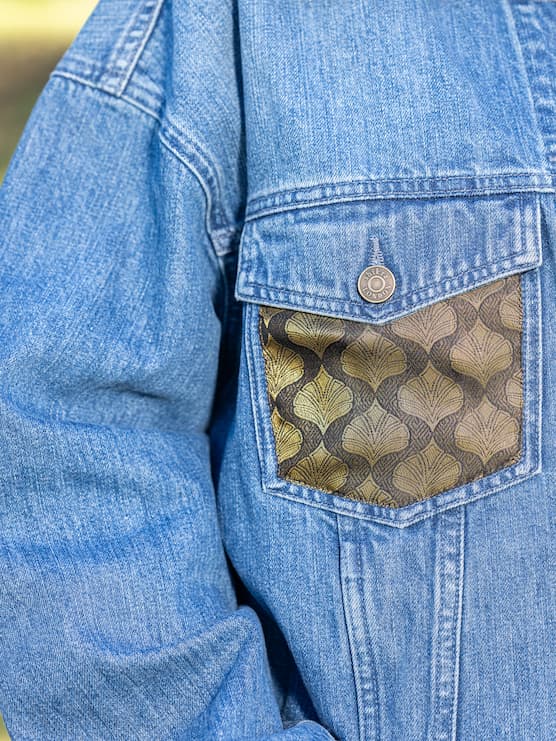 Outside pocket of Indo-western denim jacket with vegan silk saree panels in black